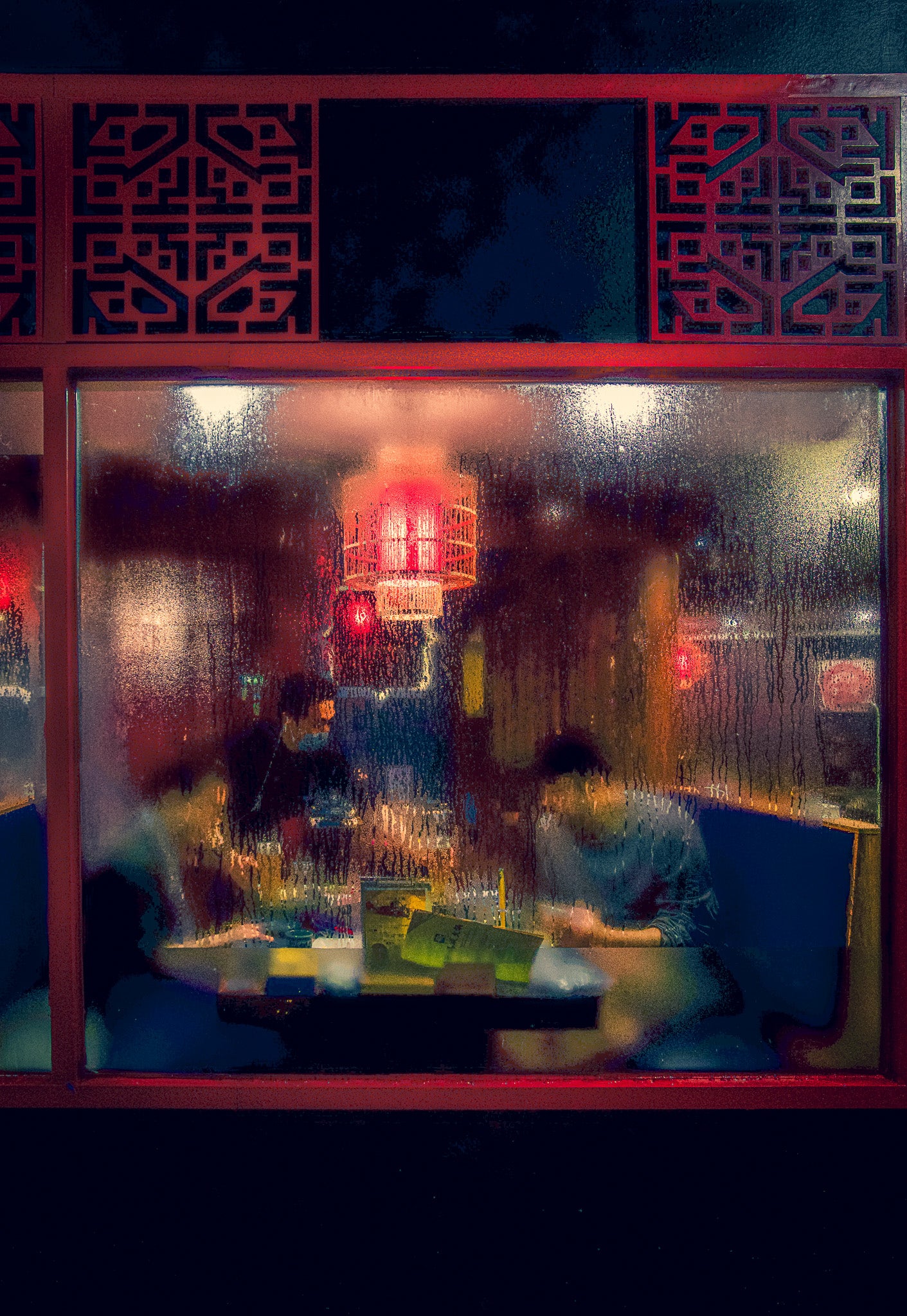 Condensation on this Chinese Restaurants window creates a painterly effect of the customers inside.

