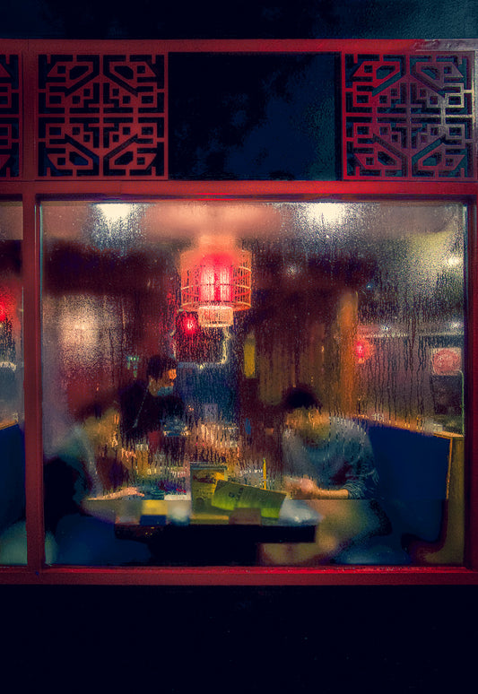 Condensation on this Chinese Restaurants window creates a painterly effect of the customers inside.
