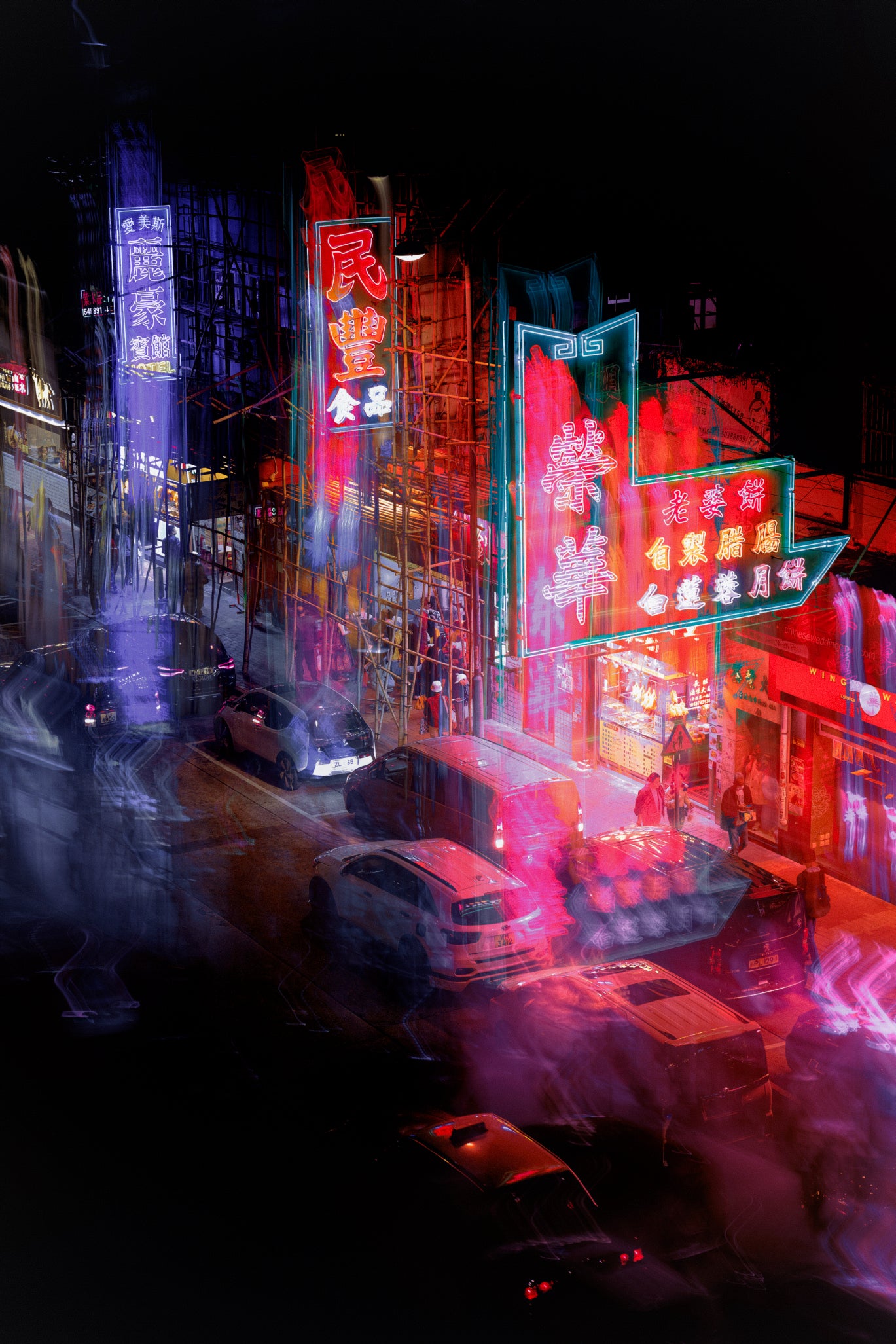 Vibrant long-exposure photograph of a neon-lit street at night, featuring colorful Chinese-style storefront signs in red, pink, blue, and green, with blurred cars and pedestrians creating a dynamic urban scene.
