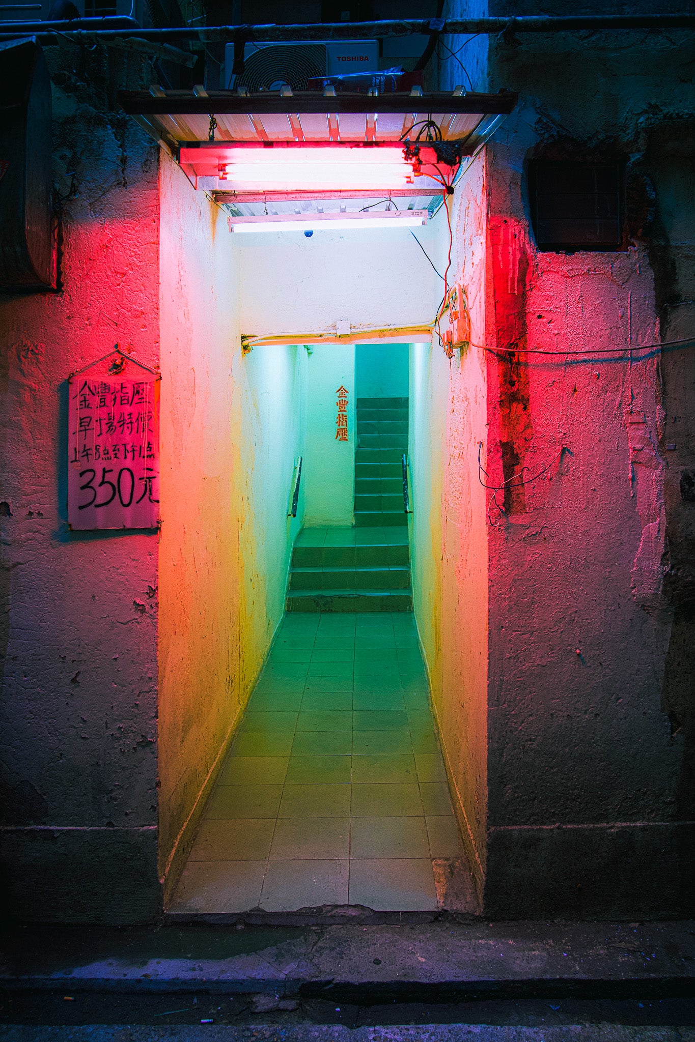 A vibrant kaleidoscopic doorway with red and blue neon lighting and a sign above the entrance reading '3500'. The image has a chromoluxe gloss metal print display finish.